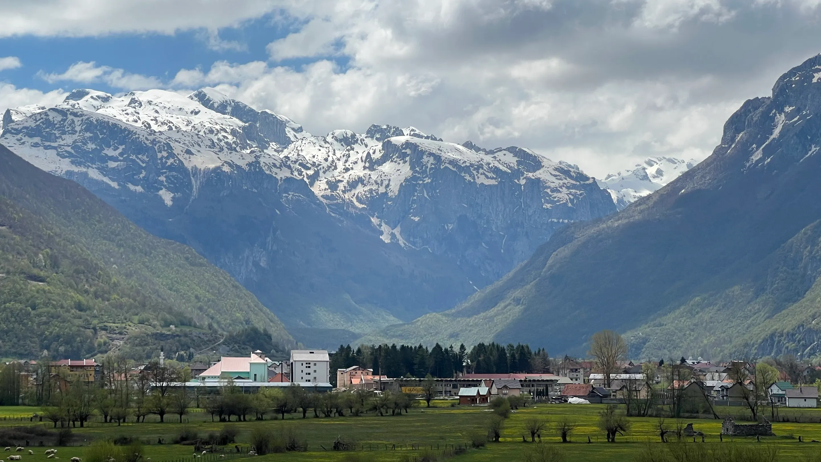 The valley at Gusinje under the snow-streaked peaks of the Prokletije. The Ljuča runs through this valley but is not in view.